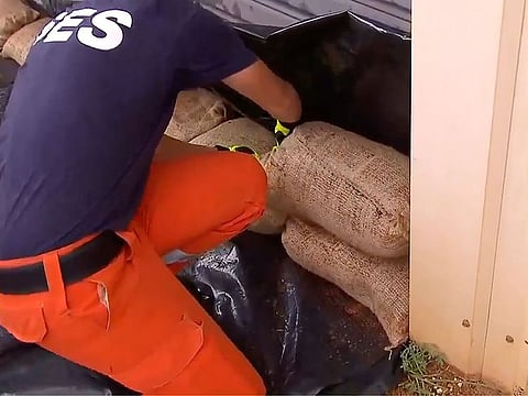 State Emergency Services (SES) workers sandbagging in Port Hedland, Australia.