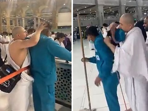 The unidentified man gives massage to a cleaner in Grand Mosque in Mecca.