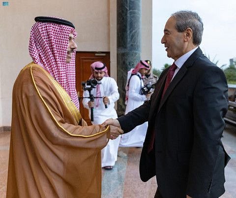 Saudi Foreign Minister Prince Faisal bin Farhan welcomes his Syrian counterpart Faisal Mekdad for talks in Jeddah on April 12.  