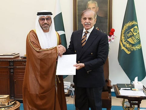 Hamad Obaid Ibrahim Salem Al Zaabi, UAE's ambassador to Pakistan, delivers an invitation to Pakistan Prime Minister Shehbaz Sharif to attend COP28 in Dubai