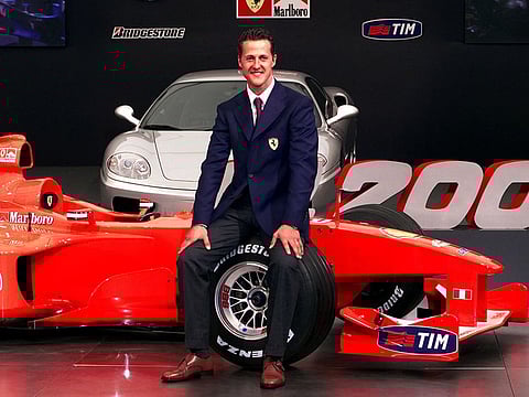 German driver Michael Schumacher sits on the new F1-2000 in Ferrari's headquarters in Maranello on February 7, 2000.