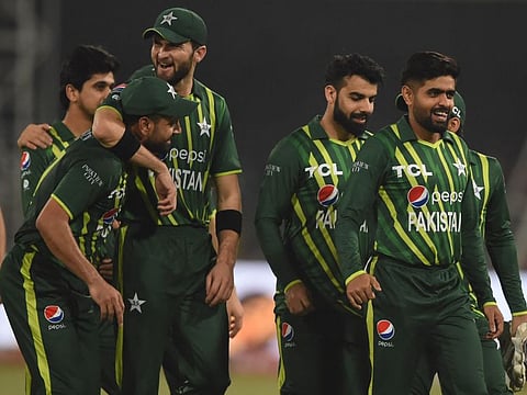 Pakistan's captain Babar Azam (right) and teammates celebrate after winning the first Twenty20 cricket match against New Zealand at the Gaddafi Cricket Stadium in Lahore.