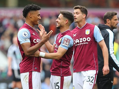 Aston Villa striker Ollie Watkins (left) and defender Alex Moreno (centre) celebrate on the pitch after the English Premier League match against Newcastle Utd at Villa Park in Birmingham.