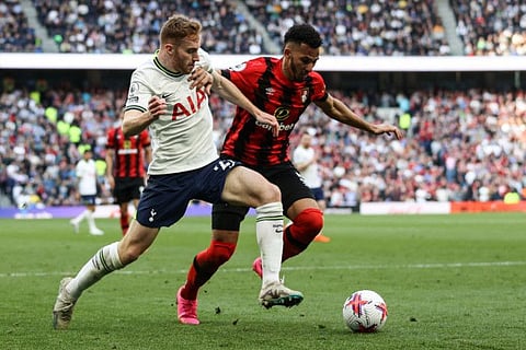 Tottenham Hotspur midfielder Dejan Kulusevski (left) fights for the ball with Bournemouth defender Lloyd Kelly during the English Premier League match at Tottenham Hotspur Stadium in London.