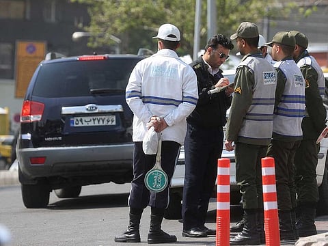 Iran's police forces stand on a street amid the implementation of the new hijab surveillance in Tehran, Iran, April 15, 2023. 