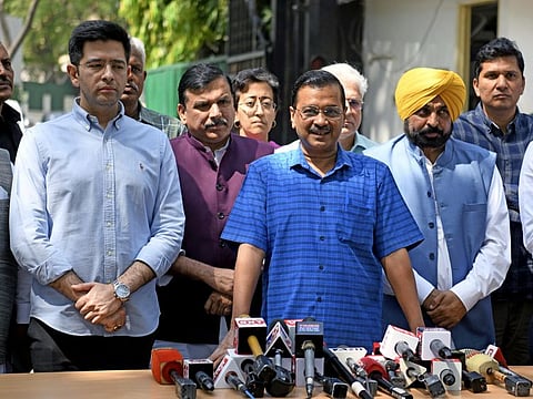 Delhi Chief Minister Arvind Kejriwal with Punjab Chief Minister Bhagwant Mann, Aam Aadmi Party (AAP) leaders Raghav Chadha, Sanjay Singh and others address the media prior to appearing before the Central Bureau of Investigation (CBI) for questioning in connection with the Delhi excise policy case, outside his residence, in New Delhi on Sunday, April 16, 2023.