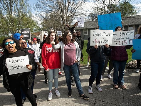 Protestors march in Kansas City, Mo., to bring attention to the shooting of Ralph Yarl.