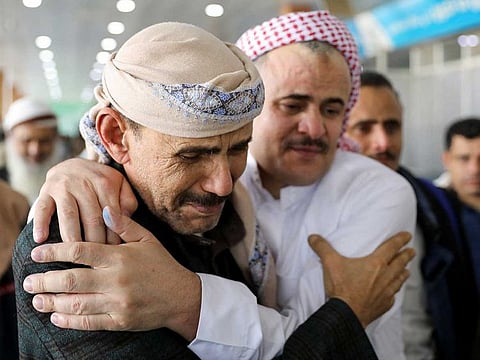 A freed detainee, released unilaterally by Saudi Arabia, embraces a relative at Sanaa Airport after arriving on an International Committee of the Red Cross (ICRC) plane, following three days of prisoner swaps between two sides in the Yemen conflict, in Sanaa, Yemen, April 17, 2023. 