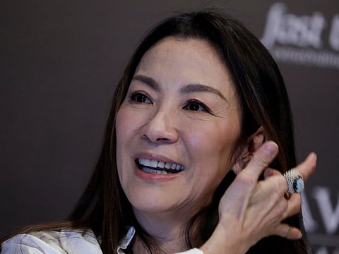 Malaysian actress Michelle Yeoh smiles during a news conference after returning to her home country for the first time since winning her first Oscar..