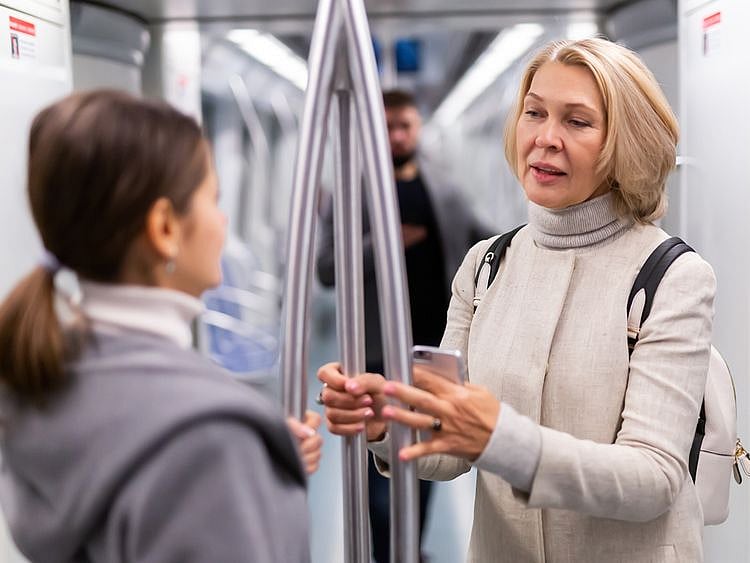 Women talking on a train
