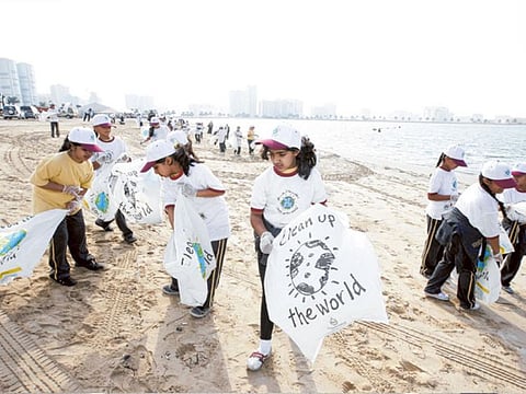 File photo show students from Al Ebdaa Model School take part in the Dubai Municipality Clean Up Campaign on Mamzar Beach.  