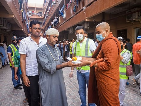 (right) ﻿Ven. Muwagammana Santha dhamma Thero of Sri Lankaramaya Buddhist Temple and Meditation Centre attended the iftar distribution at workers’ accommodations in Al Muhaisnah, Dubai