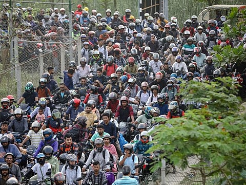 People on motorcycles gather at the toll plaza of Padma Bridge as they leave Dhaka to celebrate Eid Al Fitr at home with family, in Munshiganj, Bangladesh, April 20, 2023. Bangladesh is facing an acute shortage of power in the country.