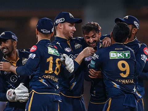Gujarat Titans' players celebrate after winning the match against Lucknow Super Giants on Saturday.