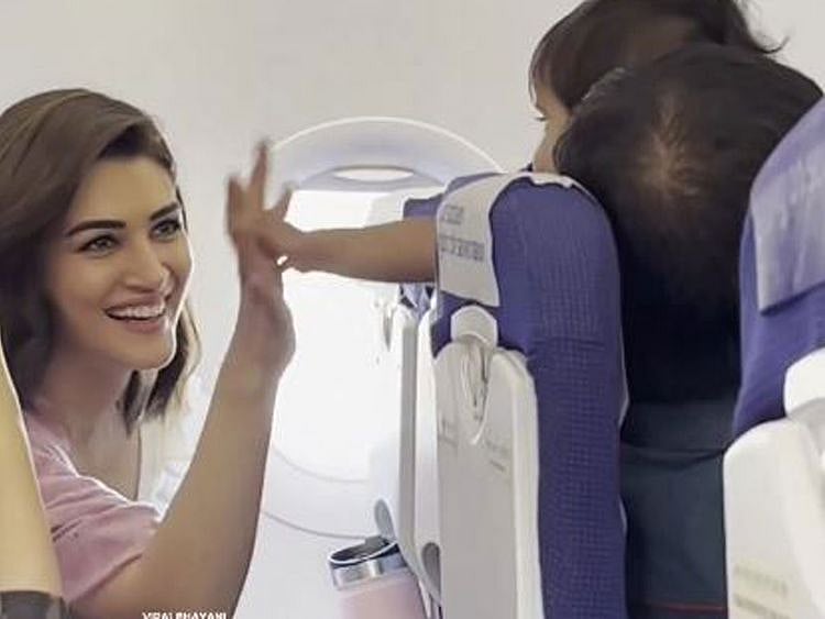 Kriti Sanon playing with a kid on flight.