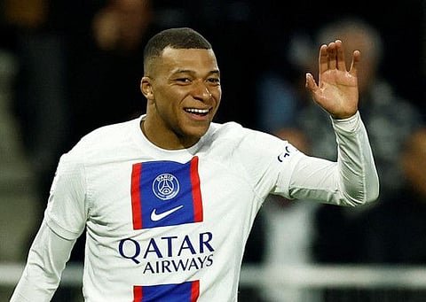 Paris St Germain's Kylian Mbappe celebrates after scoring the first goal against Angers in Ligue 1 on Friday.