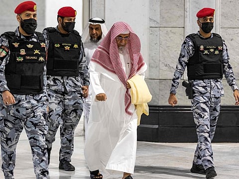 Saudi security forces guard worshippers arriving at the Grand Mosque in Mecca for the morning prayer on the first day of Eid on April 21.