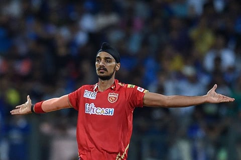 Punjab Kings' Arshdeep Singh celebrates after taking a wicket against Mumbai Indians.