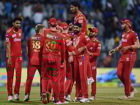 Punjab Kings' players celebrate after winning the match against Mumbai Indians Wankhede Stadium on Saturday.