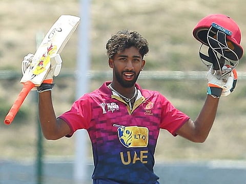 UAE's Vriitya Aravind celebrates after reaching his century against Singapore in the ACC Premier Cup in Nepal on Sunday.