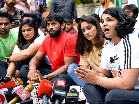 Wrestlers Vinesh Phogat, Bajrang Punia, Sangeeta Phogat and Sakshi Malik interact with the media during a protest against the Wrestling Federation of India (WFI) chief Brij Bhushan Singh, at Jantar Mantar, in New Delhi on Sunday, April 23, 2023. 