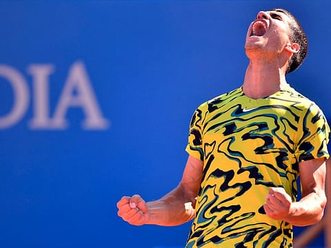 Carlos Alcaraz celebrates his victory over Greece's Stefanos Tsitsipas in the Barcelona Open final on Sunday.