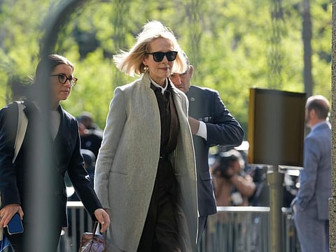 Former advice columnist E. Jean Carroll walks into Manhattan federal court on Tuesday, April 25, 2023, in New York.  Jury selection is scheduled to begin in a trial over Carroll's claim that former President Donald Trump raped her nearly three decades ago in a department store dressing room.