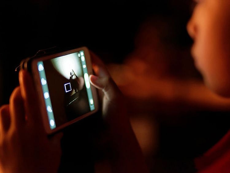 Child watching phone video