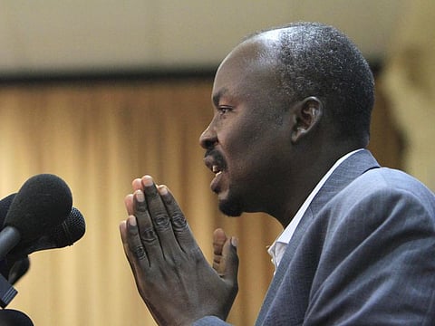 In this file photo taken on July 26, 2011 Ahmad Harun, the then governor of Sudan's embattled state of South Kordofan, speaks to reporters in Khartoum.  