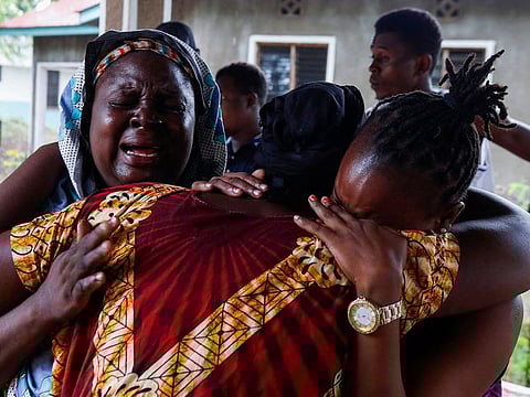 Naomi Kahindi, who lost her sister and her children,  mourns at the Malindi sub district hospital mortuary in Malindi, Kenya.
