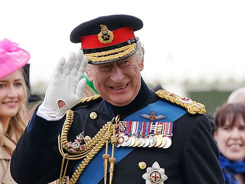 Britain's King Charles III smiles as he meets guests after a ceremony to present the new standards and colours to the Royal Navy, the Life Guards of the Household Cavalry Mounted Regiment, The King’s Company of the Grenadier Guards and The King’s Colour Squadron of the Royal Air Force at Buckingham Palace, in London, on April 27, 2023.