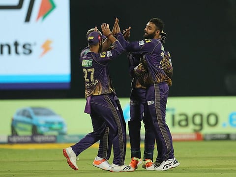 Varun Chakaravarthy of Kolkata Knight Riders celebrates the wicket of Glenn Maxwell during ther IPL match in Bengaluru on Wednesday.