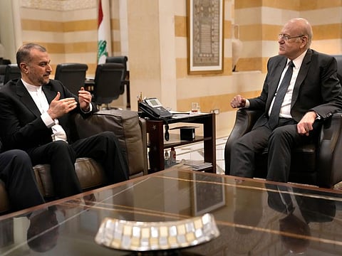 Lebanese caretaker Prime Minister Najib Mikati, right, meets with Iranian Foreign Minister Hossein Amir-abollahian, in Beirut, on Thursday, April 27, 2023.  