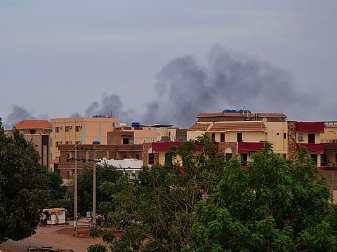 Smoke billows over residential buildings in Khartoum.