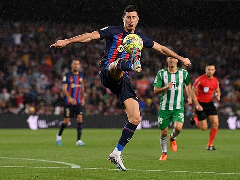  Barcelona's Polish forward Robert Lewandowski controls the ball during the Spanish league football match between FC Barcelona and Real Betis at the Camp Nou stadium in Barcelona on April 29, 2023