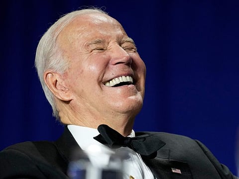 President Joe Biden laughs as comedian Roy Wood Jr., a correspondent for "The Daily Show," speaks during the White House Correspondents' Association dinner at the Washington Hilton in Washington, Saturday, April 29, 2023.