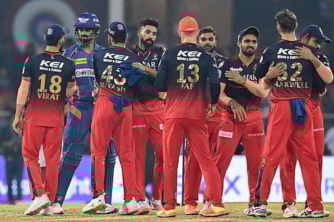 Lucknow Super Giants' KL Rahul (second from left) greets Royal Challengers Bangalore's players at the end of the IPL match.