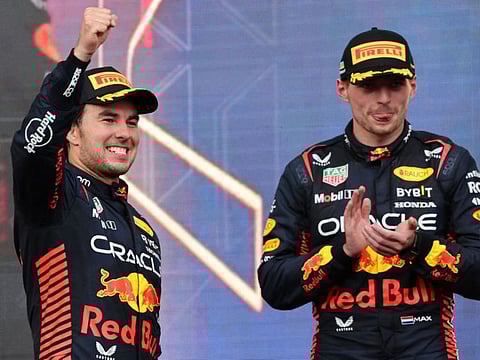 Red Bull's Sergio Perez celebrates on the podium along with Max Verstappen in Baku on Sunday.