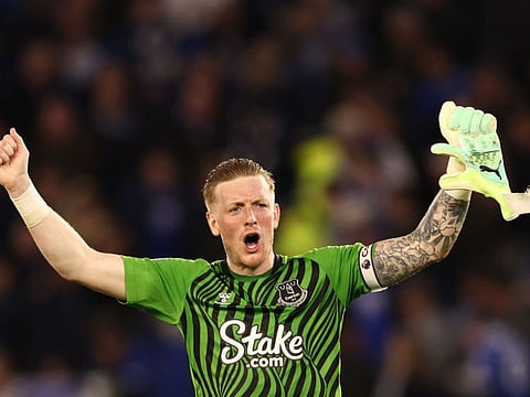 Everton's English goalkeeper Jordan Pickford reacts at the end of the English Premier League match against Leicester City.