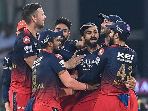 Australian pacer Josh Hazlewood celebrates with Royal Challengers Bangalore teammates during the IPL match against Lucknow Super Giants on Monday.
