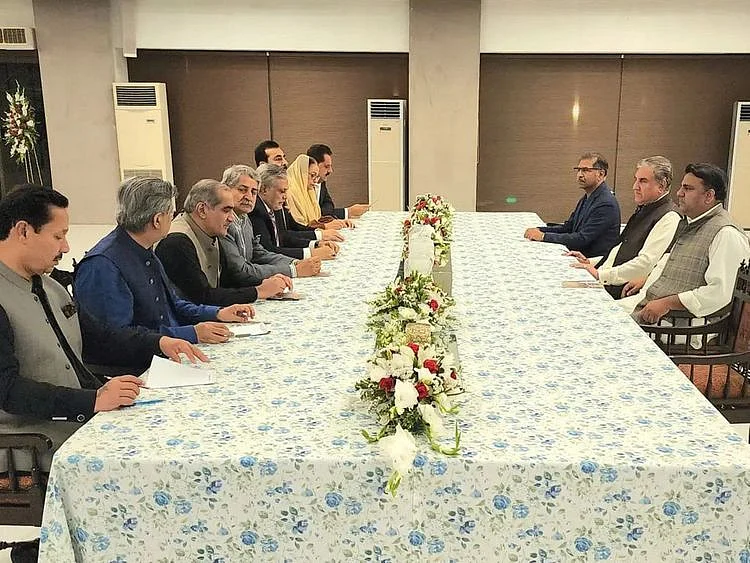 Representatives of the ruling Pakistan Democratic Movement (PDM) and ex-PM Imran Khan’s PTI party hold talks to reach a consensus on elections, in Islamabad on May 2, 2023. 