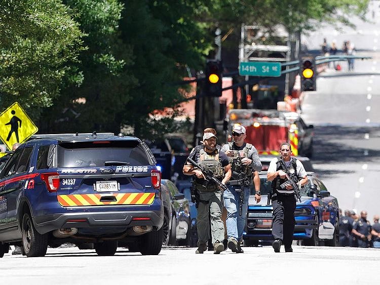 Law enforcement officers arrive near the scene of an active shooter 