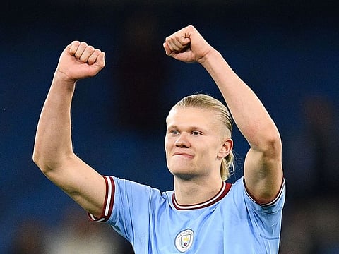 Manchester City's Erling Haaland celebrates the title of "most goal in a single season" after the match against West Ham at Etihad Stadium on Wednesday.