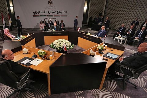 Jordan's Foreign Minister Ayman Safadi, centre background, Saudi Arabia's Foreign Minister Prince Faisal bin Farhan Al Saud, second left, Iraqi Foreign Minister Fouad Hussein, left, Egyptian Foreign Minister Sameh Shoukri, right, and Syrian Foreign Minister Faisal Mekdad, second right, attend a regional consultative meeting in Amman, Jordan, Monday, May 1, 2023.  