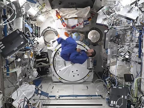 A screengrab of the video shows Sultan Al Neyadi doing the bicycle moves used in jiu-jitsu on board the International Space Station. 