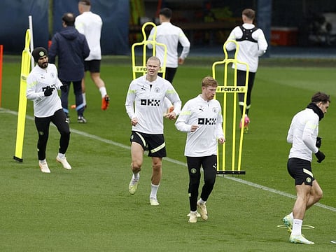 Manchester City's Erling Haaland, Kevin De Bruyne and Ilkay Gundogan during training a session on the eve of the semifinals against Real Madrid.