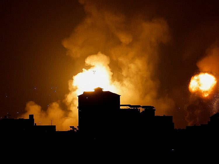  Smoke and flames rise into the sky after the Israeli military said in a statement that it has struck Islamic Jihad targets, in Gaza, May 9, 2023.  