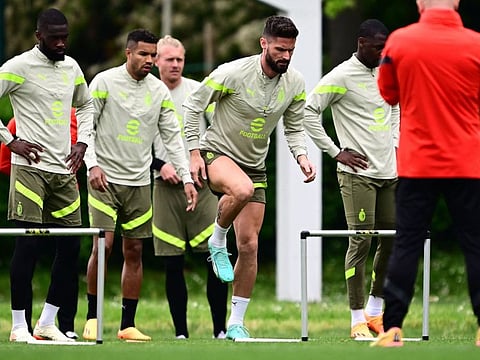 AC Milans French forward Olivier Giroud (centre) exercises during a training session at The Milanello Sports Centre at Carnago, north-west of Milan on Tuesday.