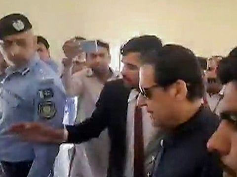 Pakistan Tehreek-e-Insaf (PTI) chairman Imran Khan being released after the Supreme Court declared his arrest as an illegal, in Islamabad, Pakistan on Thursday.  