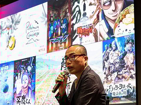 This photo taken on March 24, 2023 shows content director Yuji Yamano speaking during a media tour and press conference at the office of streaming giant Netflix in the Roppongi area of Tokyo. 